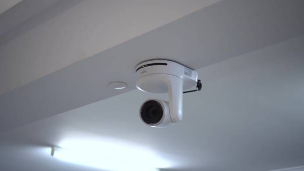 istock An electric drive camera with remote control is located under the ceiling in the room. Camera for live broadcasting and video recording. Approaching an object. 1452524840