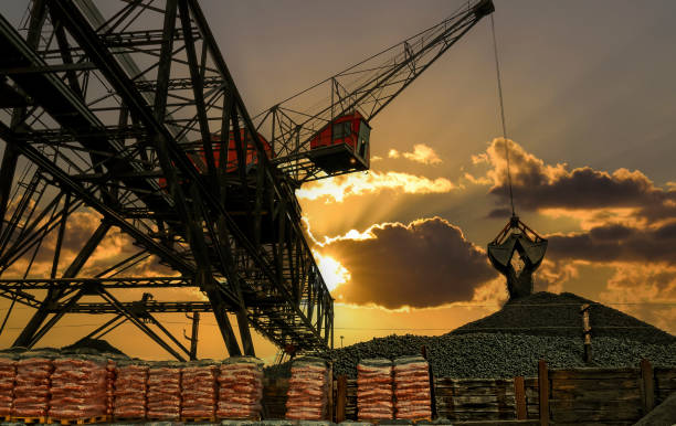 Red coloured coal crane off-loading coal at the harbour area at city Vejle harbour, Jutland, Denmark
