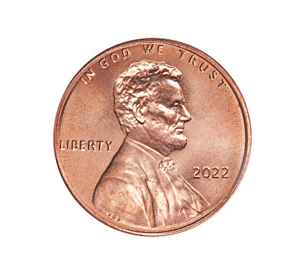 Various U.S. pennies on white background.