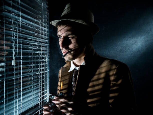 istock A private detective by the window with blinds. 1452526380