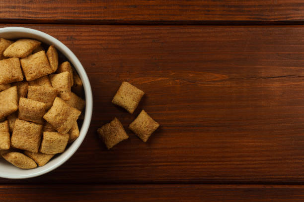 istock Chocolate breakfast pads in a white bowl on a dark table. Top view 1452527310