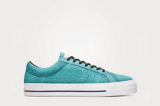 Turquoise sneaker on a white background