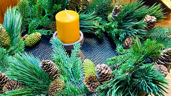 Advent wreath and a yellow candle