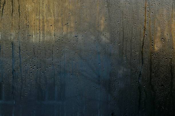 istock water drop background. condensate on glass 1452531742