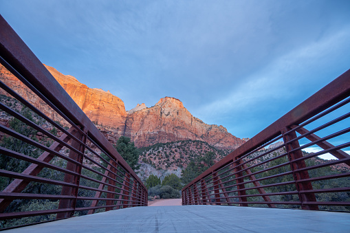Low angle View of Bridge to Zion Large Rock Mountains on the other Side