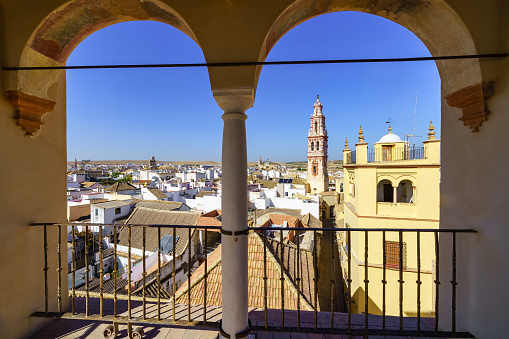 Panoramic view of the city of Ecija with its white houses, Arab roofs and church towers, Seville