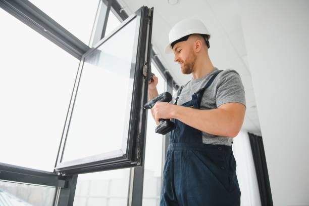 istock Construction worker repairing plastic window with screwdriver indoors, space for text. Banner design 1452533823