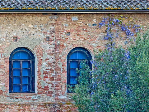 Window features of apartments along the streets of Siena in Tuscany Italy