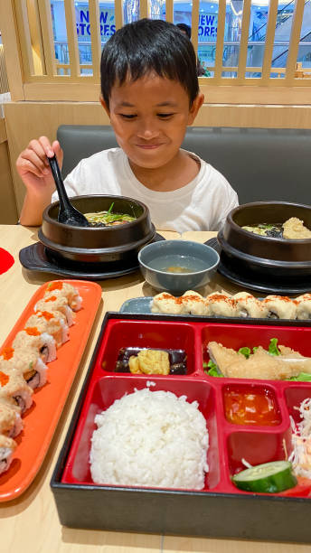 child boy eating japanese food
