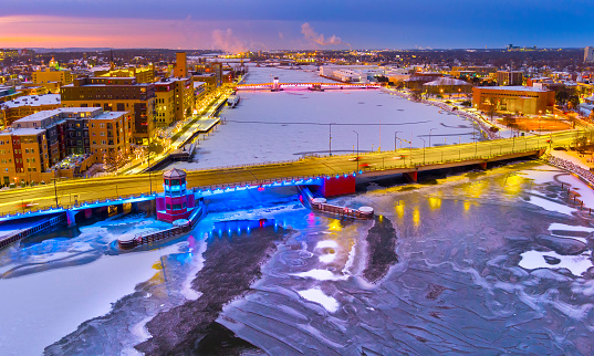 Ice covered river with city lights. This is downtown Green Bay, Wisconsin in the holiday season.