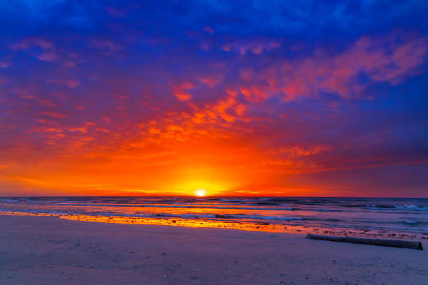 Incredible red Winter sunrise over Lake Michigan, with mammatus clouds.