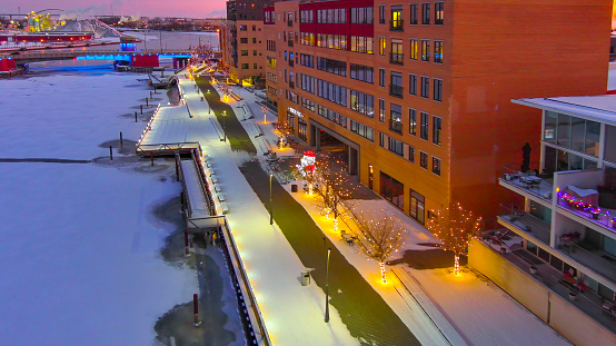 Ice covered riverfront walk, with holiday lights, downtown, Green Bay, Wisconsin.