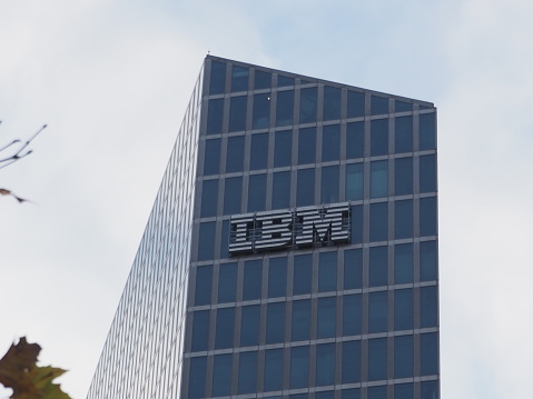 Munich, Bavaria Germany - December 11 2020: IBM International Business Machines Corporation logo german headquarters. Watson IoT Center artificial intelligence research development building. Ultra HD.