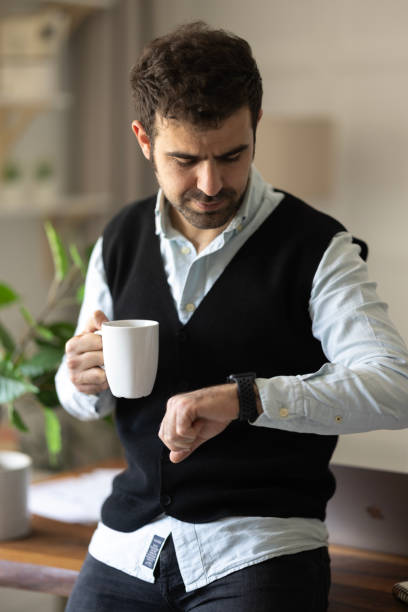 istock Young businessman relaxing on comfortable with cup of coffee. 1452544480