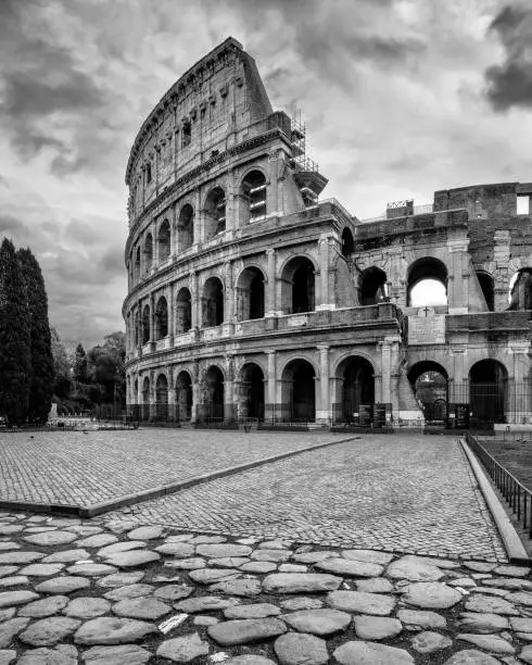 A grayscale shot of the Colosseum in Rome, Italy
