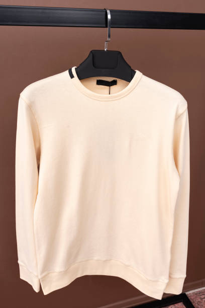 istock Yellow sweatshirt hanging on a hanger. 1452546023