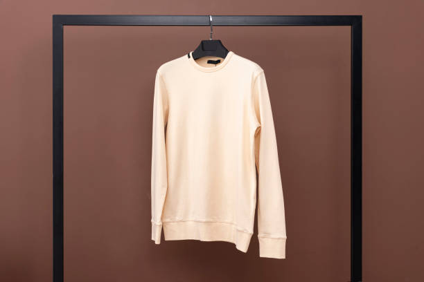 istock Yellow sweatshirt hanging on a hanger. 1452546053