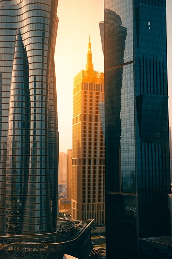 The bright sun shining over a skyscraper in Doha, Qatar