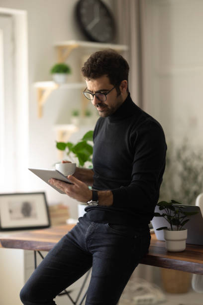 istock Businessman sitting at his desk and using laptop in the office 1452548405