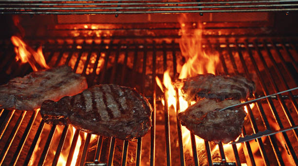 istock A mix of pork and Rib-eye Steak on a BBQ open fire 1452548503