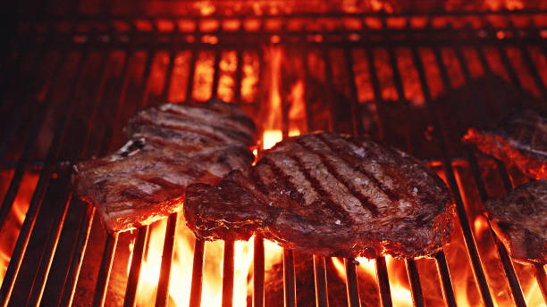 istock Cooking meat on a very hot grill 1452548697