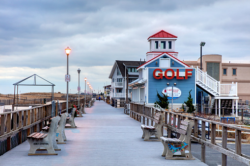 Point Pleasant, New Jersey, USA - December 12, 2022:  Evening view of the one mile Jenkinson's Boardwalk along Point Pleasant Beach