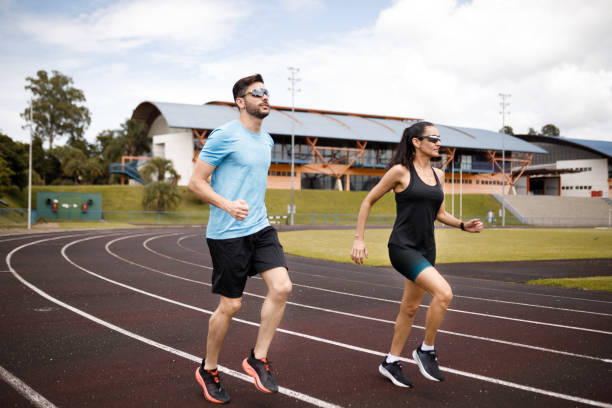 istock Couple running together on the field 1452554114