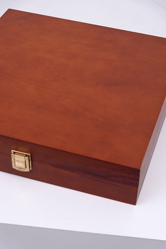 Gift box close-up. Casket case isolate on a white background. Hand made exotic wood box.