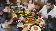 istock Group of coworkers having after work party in yakiniku restaurant 1452556626