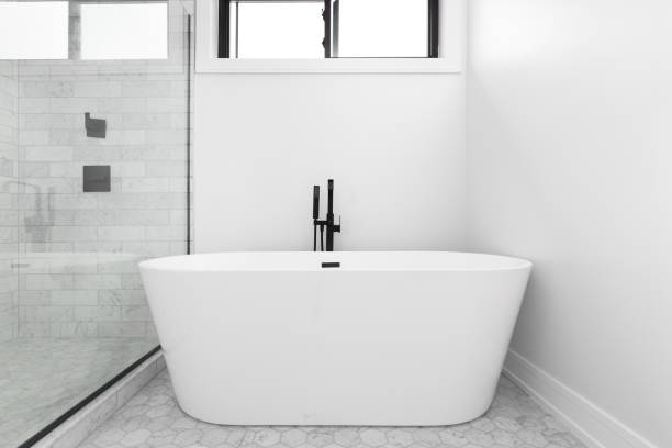 istock A modern bathroom with a standalone tub with a black faucet. 1452558776