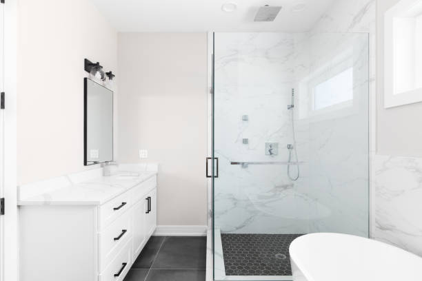 istock A bathroom with a white cabinet and tiled shower. 1452559818