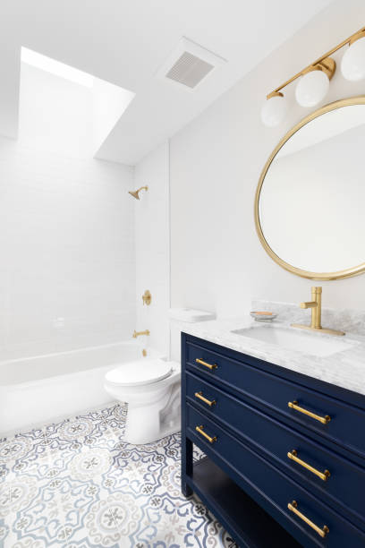 istock A bathroom with a blue cabinet and mosaic tiled floor. 1452561395