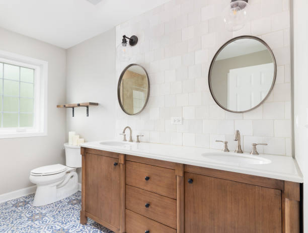 istock A bathroom with a wood cabinet and mosaic tile floor. 1452561461