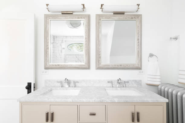 istock A bathroom with a tan cabinet and marble countertop. 1452561515