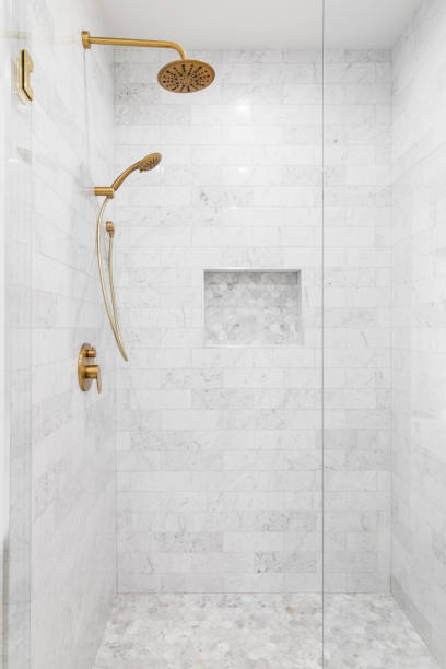 istock A luxury shower with gold shower head and marble tiles. 1452562254