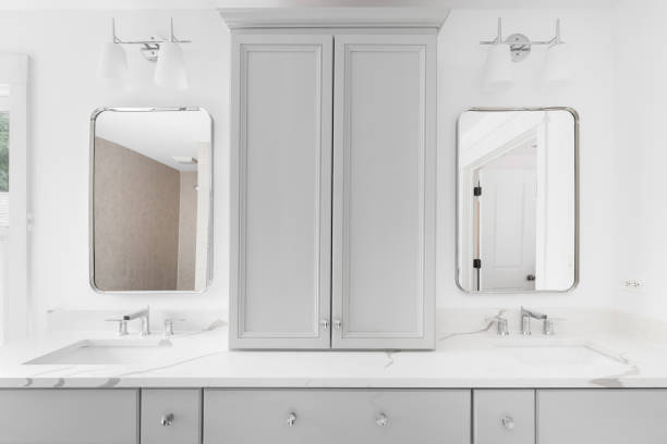istock A bathroom with a grey cabinet and white marble countertop. 1452562374