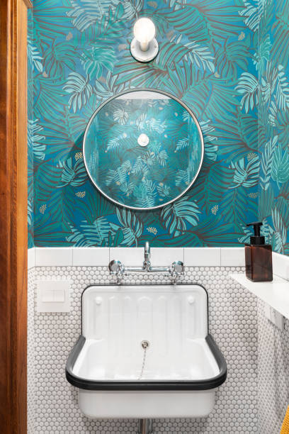 istock A renovated bathroom with green wallpaper. 1452562456
