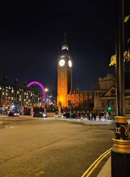 istock Big Ben clock tower and London Eye at night. 1452562478