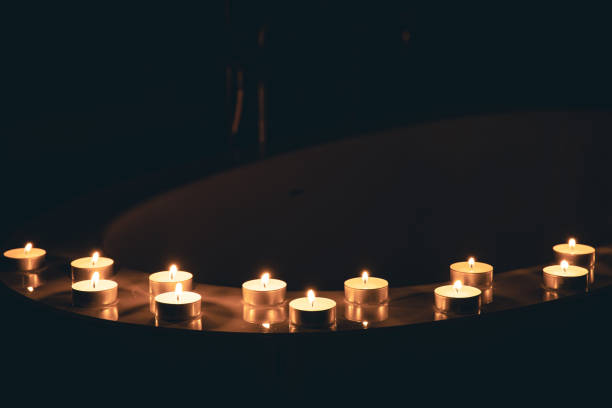 istock Burning candles in the bathroom in the dark. 1452563522