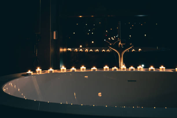 istock Burning candles in the bathroom in the dark. 1452563532