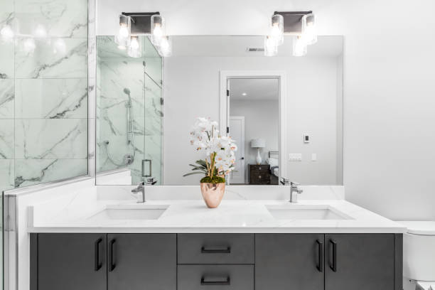 istock A bathroom with a grey cabinet and white marble countertop. 1452564455