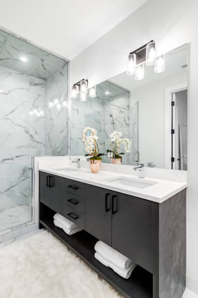 istock A modern bathroom with a grey cabinet and marble tiled shower and floor. 1452564456