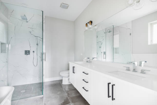 istock A white luxury bathroom with a shower and standalone tub and a tiled floor. 1452564510