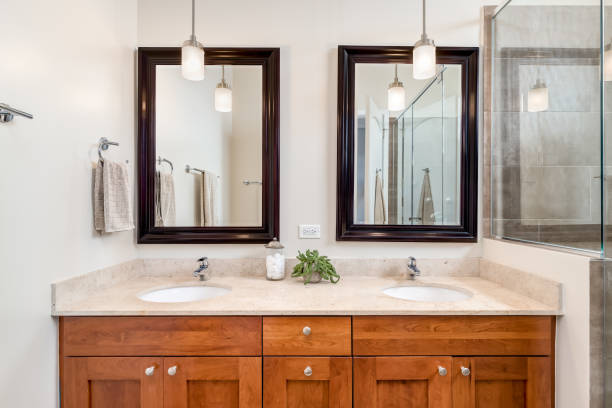 istock A bathroom with a wood cabinet and granite countertop. 1452564544