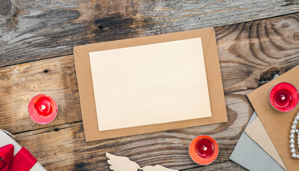 istock Envelope and blank paper on wooden background, Valentine's day concept. 1452564742