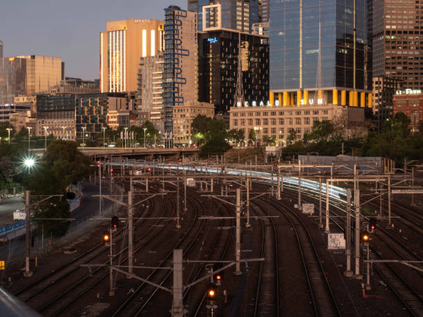istock Sunrise over urban skyline and train tracks 1452566414