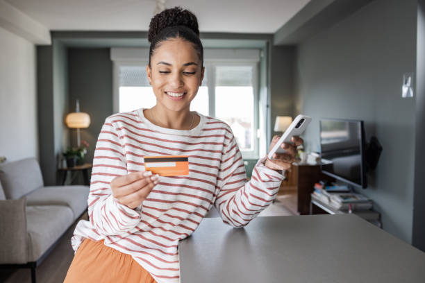 Young woman using smartphone to shop online