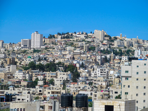BETHLEHEM, ISRAEL - APRIL 21, 2014: View of part of the city of Bethlehem.  Bethlehem is a Palestinian city, located near Jerusalem. The economy is primarily tourist-driven.