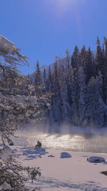 istock River in snowy mountains on a sunny day 1452577667