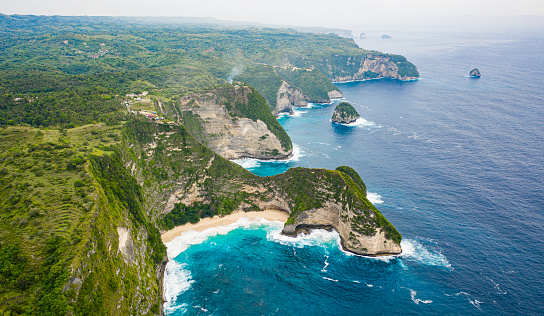 Aerial view of the most famous beach in the island of Nusa Penida, Kelingking Beach, witch has a trail of 40 minutes down to arrive at the sand.